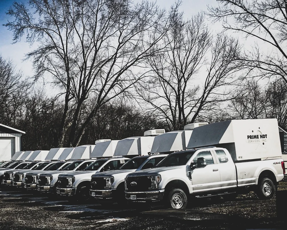 The Prime NDT mobile inspection fleet lined up at a regional yard